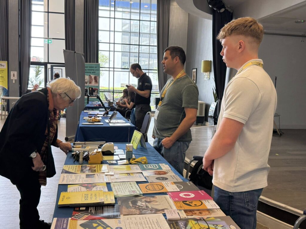 Staff and Volunteers at an Outreach event demonstrating equipment and information sources
