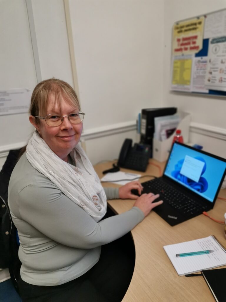 Karen Jones at her desk